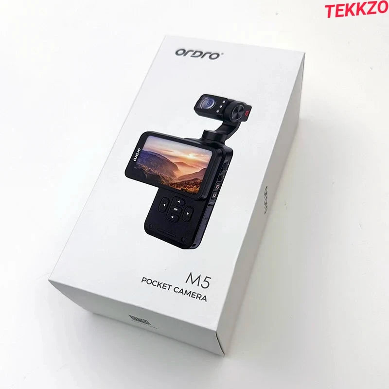 Ordro M5 pocket camera box featuring compact black camera with screen displaying mountain sunset