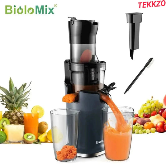 BioloMix black slow juicer extracting carrot juice with pulp and juice glasses, fresh fruits around