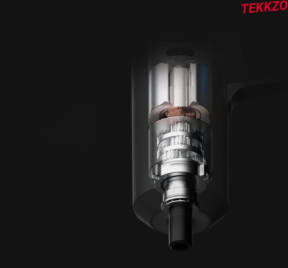 Close-up of transparent mechanical device with visible copper coil and internal gears against black background